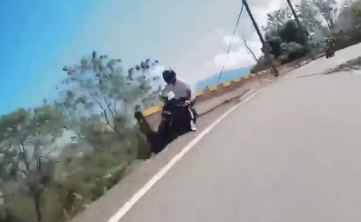 Motorbiker Loses Control, Falls Down Side of Mountain