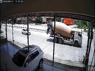 Woman Survives Being Crushed Between 2 Trucks