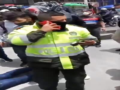 Colombian Officer Runs Red Light, Hits Pedestrian