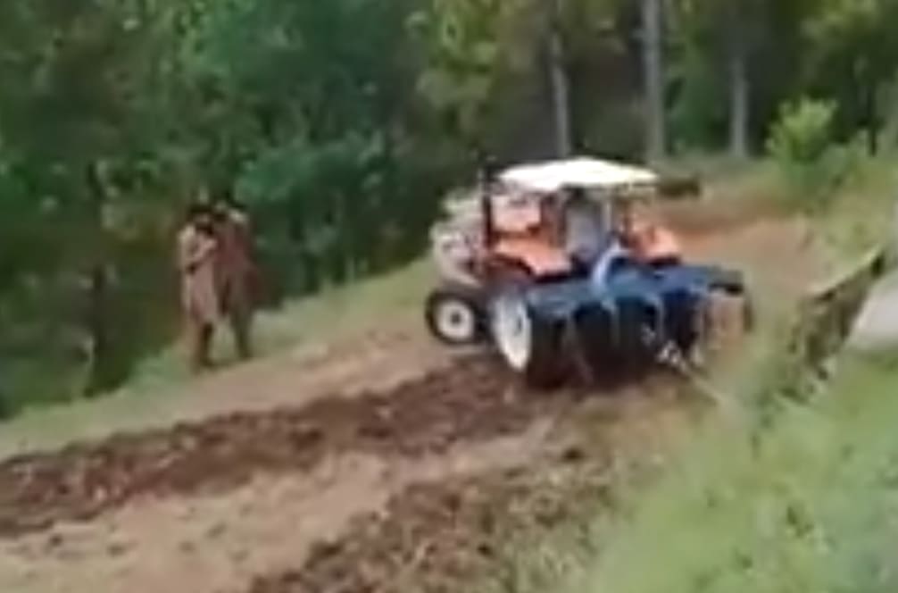 Moron Behind the Wheel of a Tractor