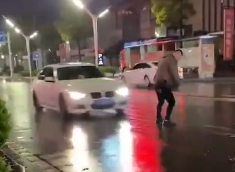 BMW Plows Through Dude in the Street