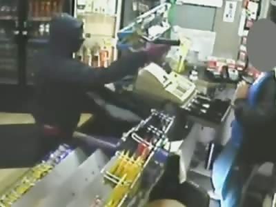 Armed robbery at shop in Manchester caught on CCTV