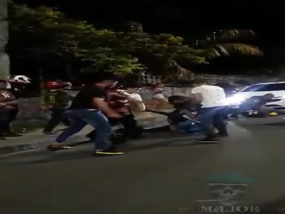man brutally beaten with kicks and helmets by angry mob