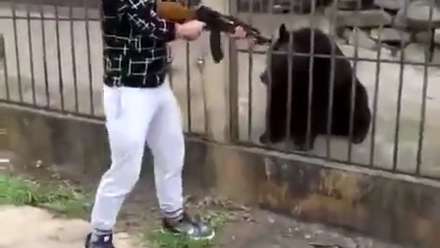 [ASSHOLE] Chinese Man Shoots Black Bear In Head at POINT BLANK RANGE!