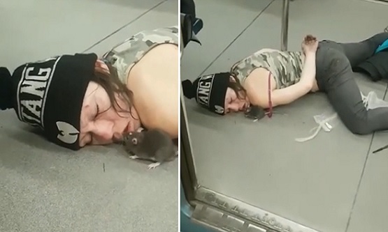Overdosed Woman Lays On Subway Floor As A Mouse Eats Out Of Her Mouth