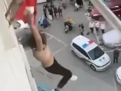 Asian Woman Trapped falls Out of Her her Hoodie to Her Death from Balcony