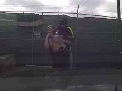 Black Man pulls up Shirt of Female Officer