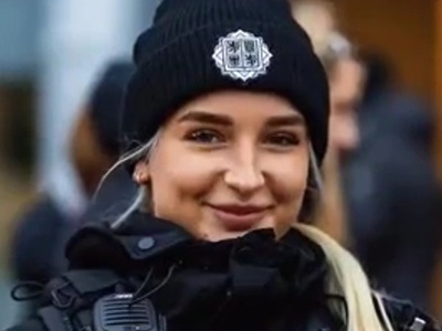 Photographer makes female officers smile
