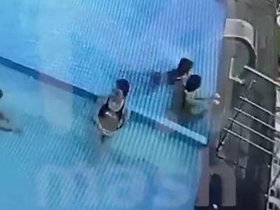 Terror as Girl's hair gets Sucked into Drain of Pool.