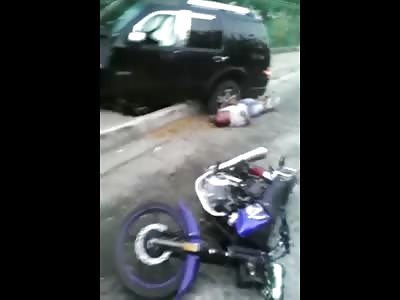 Thugs Ran Over by Victim ... One Laying in the Street with a Major Arm Convulsion Going on