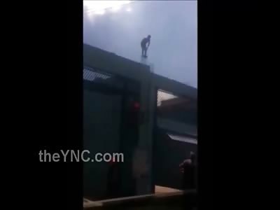 In a Very Bizarre Suicide a Man Jumps Head First in Front of His Family