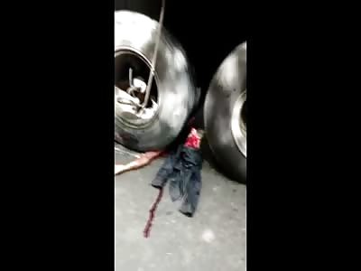 Short Video of Corpse Crushed under Truck Wheels Cut in Half 