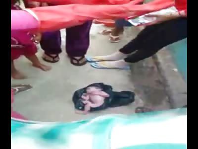 Shocking Videos Shows Baby That Was Put in a Trash Bag and Thrown Away Still Alive with Placenta Still Attached