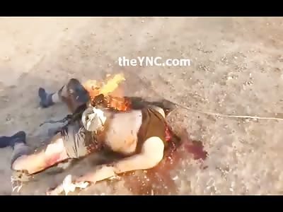 Headless ISIS Member Burns in the Desert 