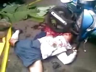 School Girl in Dress Head Crushed and Split by a Motorcycle Wheel