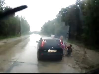 AMAZING VIDEO: Little Boy Peeing on Side of the Road is Ran-over Along with his Father