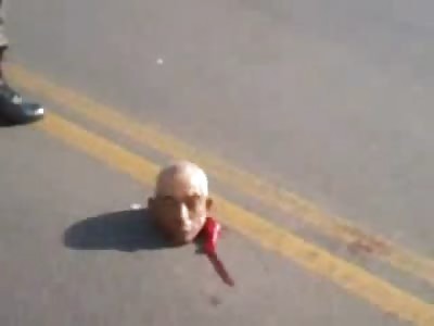 Headless Mans Head left in a Perfect Upright Position in the Street 