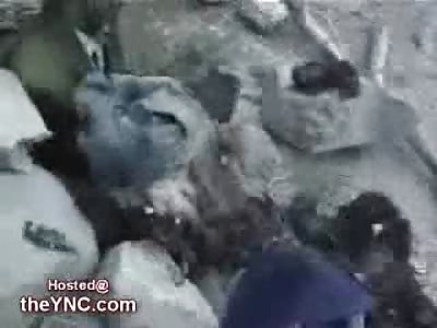 Yemeni Man pulls his Wife out of a Foxhole with half her Head missing (Extremely Graphic)