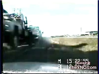 Semi Truck Takes out a Car Pulled over by Police