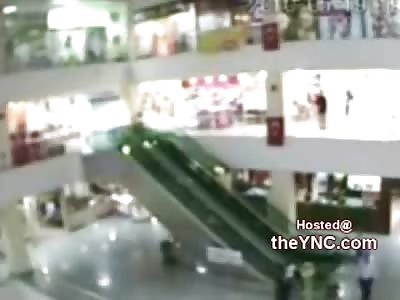 Store Manager Catches Falling kid off the Mall Escalator 