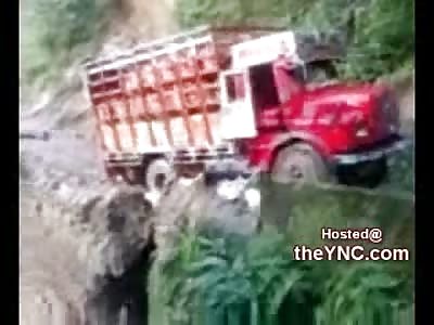 What Happens when a Dump Truck gets Stuck on a Mountainside Dirt Road