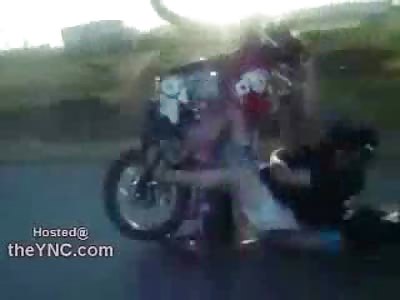 3 Idiots on a Bike trying a Wheelie Ends Very Bad Watch the Kid in the Back)