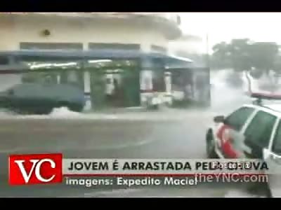 WOW: Lady Nearly Decapitated When Flood Waters Brutally Smash Her Against Parked Car