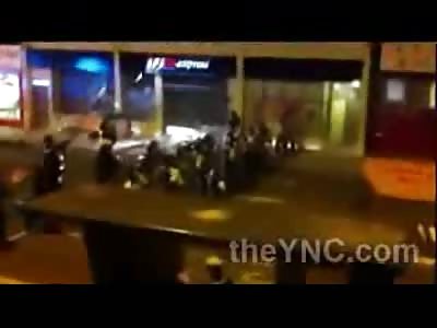 FUCK: Concrete Rock Dropped on Riot Police Officers Head 