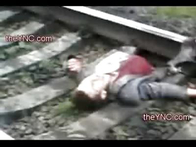 REMARKABLE Video shows Businessman Alive after being Split in Half by Train (Man lived for 50 Minutes and then Died)