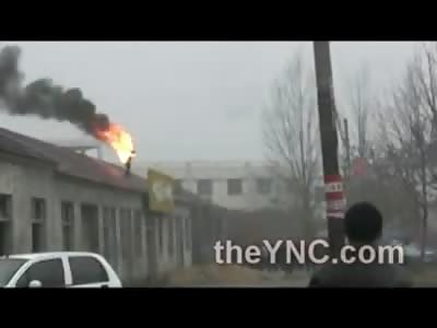 Chinese Man Burns Himself and Jumps off Roof in Protest of Land Dispute ....WOW