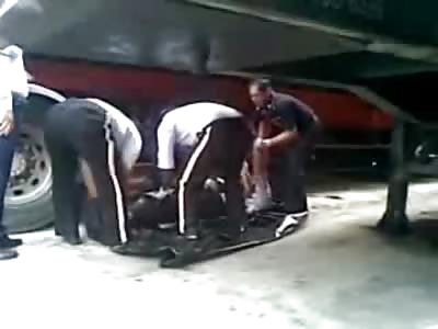 Police picking up Man from Under Truck almost forget his Severed Head under the Truck