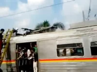 He's still Smoking!! Man Fried on top of Train is Removed and Bagged