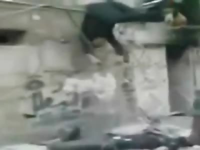 Soldiers treat Human Bodies like a pile of Garbage tossing them Off Building