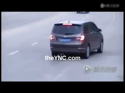 Honey,  I think we Hit Something, Suicidal Man in China stops Traffic as hes Dragged to Death on the Highway
