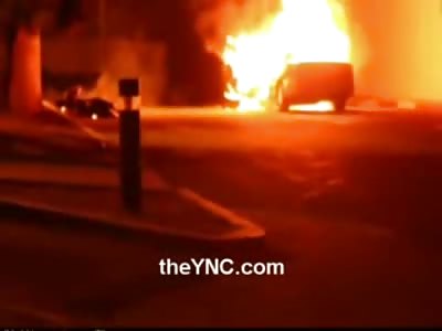 Distraught Woman Records Helplessly as Man lying next to his Car Burns Alive (Watch Full Video)
