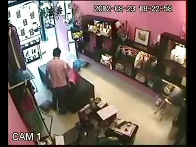 Asshole in Pink Shirt Terrorizes his Little Pretty Girlfriend inside his Clothing Store Until She Crawls out for Help
