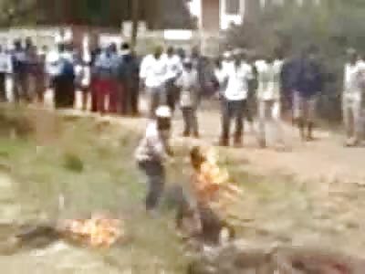 Suffering African Man is Set on Fire by Maniacal Mob, as hes Dying he is Executed with Rifle Shot to the Head (Full VIDEO)