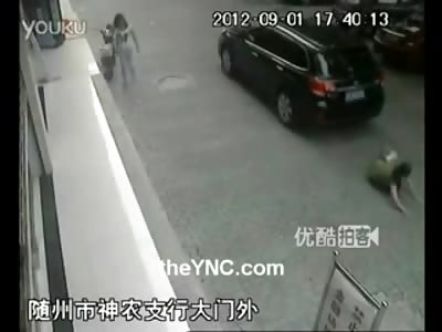 Woman Piggy Backing her little Girl is hit and Run by a Idiot Driver