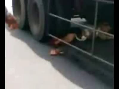Poor Female still Alive under Truck is Pulled Out to Reveal her Mutilated Legs......OUCH