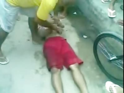 Boy in Pink Shorts is Lynched to Death by Young Kids and other Town Folk