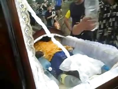 Girl in Coffin is Fitted into her Wedding Dress at Burial