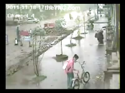 Truck Full of Cement Tips Over and Buries an Umbrella Man and a Scooter Guy