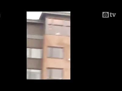 Lunatic Swan Dives off of a Building