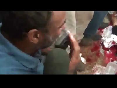 Helpless Father Watches as his Son Receives CPR from Paramedics after Being Shot in Egyptian Riot
