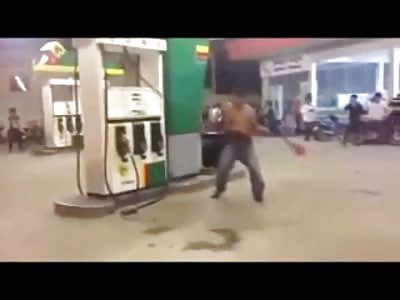 Crazy Guy holds a Gas Pump Hostage and Pays the Price