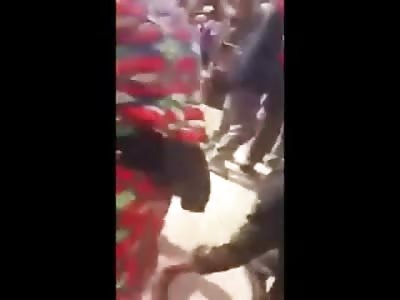 Maniacal Mob Drags Man by the Neck throughout the Streets. Half his Body already Burned (Cell Phone Footage)