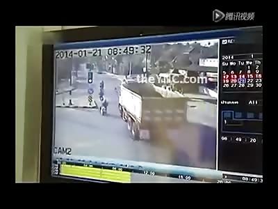 Chinese Motorcyclist makes Fatal Mistake of trying to Pass a Dump Truck with not Enough Room