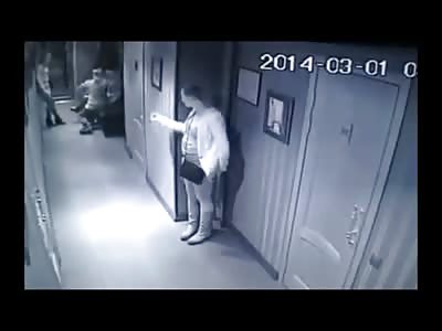 Drunk Girl Pee's in Hotel Hallway as her Friend stands over Her...right in front of Surveillance Camera
