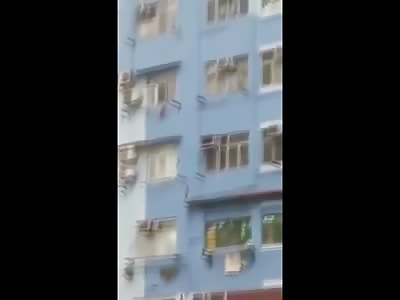 Man Eases His Way to Suicide from Rooftop on Busy Street..