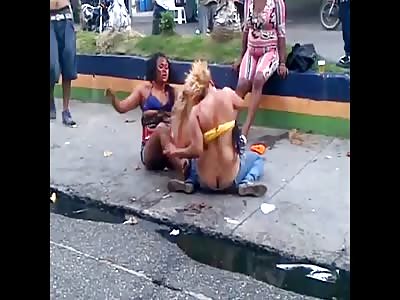 Two Woman So Winded they Continue to Fight Bloody Sitting on the Sidewalk with Boobs Out